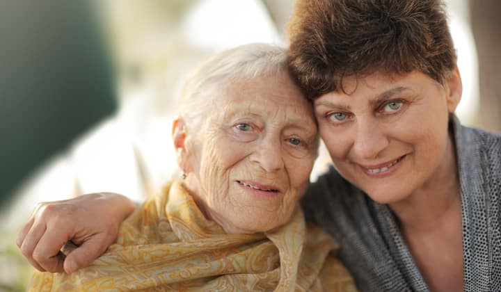 Mother and daughter smiling